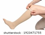 Compression garments for the treatment of lipoedema and lymphoedema.Lymphedema management: Wrapping leg using multilayer bandages to control Lymphedema. Part of complete decongestive therapy (cdt