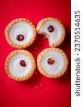 Small photo of commecial photos of Viennese Whirls and Bakewell tarts on metal tray and with coloured backgrounds