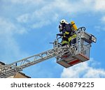 Firefighters On A Ladder
