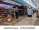 Small photo of Singapore - November 13, 2022 : Through a candid perspective, the bustling scenes of Boon Keng Hawker Center in Singapore come alive, capturing the rich tapestry of daily moments and flavors