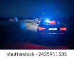 Small photo of 10.06.22 Poland. A undercover police car with emergency lights.