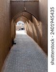 Small photo of A narrow alleyway with arches, whispered secrets of a bygone era