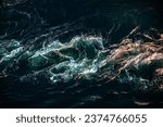 Small photo of Waves of water of the river and the sea meet each other during high tide and low tide. Whirlpools of the maelstrom of Saltstraumen, Nordland, Norway