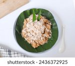 Small photo of Thiwul or tiwul, is a snack made from cassava flour, given a little sugar, then steamed, can be eaten with grated coconut that has been given a little salt. Tiwul is a traditional Indonesian food