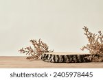 Small photo of Minimal mockup background for product presentation. wooden saw cut and dry flower over wood table surface with gray Minimalist wall background