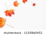 Autumn composition. Frame made of autumn maple leaves on white background. Flat lay, top view, copy space