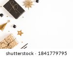 Christmas composition. Gift boxes, black and golden decorations on white background. Christmas, winter, new year concept. Flat lay, top view, copy space