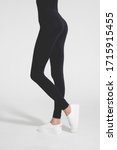 Small photo of Woman wear black blank leggings mockup, isolated, clipping path. Women in clear leggins template. Cloth pants design presentation. Sport pantaloons stretch tights model wearing. Slim legs in apparel.