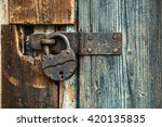 Old Rusty Lock On The Wooden...