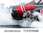 racing car drift in smoke of rubber
