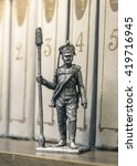 Small photo of Tin Soldier, Russian foot artillery gunner 1812-1815, year on a bookshelf.