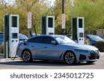 Small photo of Chandler, Arizona - Aug 07 2023: A new BMW iX M60 electric car at an Electrify America chargepoint EV charging station at the Phoenix Premium Outlets.
