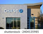 Small photo of Mesa, Arizona - October 23 2023: Sign on a modern branch of a JPMorgan Chase Bank building, doing business as Chase, an American national bank.