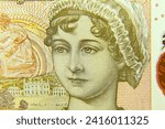 Small photo of London, UK, 2 January 2024: Close up of the reverse of a 10 note from the United Kingdom featuring a portrait of the author Jane Austen with with selective focus