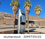 Small photo of Palm Springs, California - December 26, 2021: "History of Suspended Time: Monument for the Impossible" art installation by Gonzalo Lebrija, with the Palm Springs Art Museum in the background