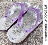 Small photo of Broken flip flops ,old flip flops, bad flip flops, inappropriate flip flops, ugly sandals ,broken sandals