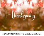 Happy Thanksgiving Greeting on Autumn leaves blur background
