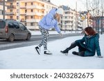 Small photo of A sympathetic person tries to help someone get up who has fallen over.