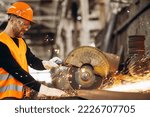 Man Cutting Steel At The Factory