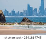 Surfers View Past Currumbin Beach Rocks