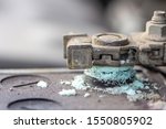 Small photo of Mechanic checking car Battery terminal in a garage . Old battery corrosion deteriorate leaking with blue acid powder. Battery terminals corrode dirty damaged problem.