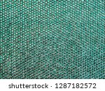 The texture of the knitted fabric, covered with small rhinestones. Thin yarn turquoise color. For textures, backgrounds.
