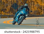 Small photo of Homem em sua motocicleta em uma curva. Man on his motorcycle on a curve. - Morungaba - Sao Paulo - Brazil. 09.13.2022