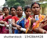 Small photo of Barpeta, Assam, India. 21 October 2019. Voters stand in a queue to cast their votes at a polling station for by-polls under Jania constituency in Barpeta district of Assam.