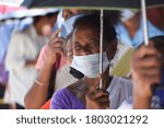 Small photo of Guwahati, India. 25 August 2020. People flout social distancing norms as they stand in a queue to register for Aadhar cards, amid the ongoing COVID-19 coronavirus pandemic, in Guwahati.