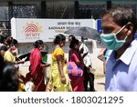 Small photo of Guwahati, India. 25 August 2020. People flout social distancing norms as they stand in a queue to register for Aadhar cards, amid the ongoing COVID-19 coronavirus pandemic, in Guwahati.