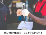 Small photo of Auto mechanic with wrench in hand. stranglehold. Closeup car repair black man hand and caucasian man customer.