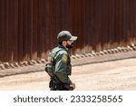 Small photo of Sasabe, AZ - July 15, 2023: A group of migrants entered the U.S. from Mexico through a hole in the border fence near Sasabe, Arizona. The group turned themselves in to a waiting CBP agent.