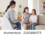 Small photo of Talking is key to understanding. Parent and child seeing psychologist together. Counseling therapist and mother listening to preteen daughter sharing school news, telling story and answering questions