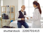 Small photo of Patient visits doctor. Worried senior citizen speaks about weak heart, chest pain, spasm, discomfort, pressure, arrhythmia, stenocardia, feeling palpitation, older age myocardial infarction or failure