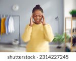 Small photo of Sick, dizzy, young woman suffering from vertigo, headache. Portrait of attractive stressed African American woman touching her head suffering from dizziness, migraine, overwork