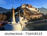 the Potala Palace and pagodas in the sunrise glow, Lhasa, Tibet