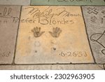 Small photo of Hollywood, California USA - May 12, 2023: Marilyn Monroe. Marilyn Monroe's Signature and Hand Prints along with the date 6-26-53 in cement at the Chinese Theater in Hollywood California. Famous.