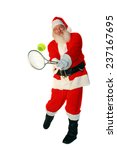 Santa claus plays tennis. focus ...