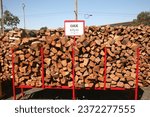 Wood. Fire Wood. Cut Fire wood for sale. Firewood cut and piled high for sale. Wood is used for Fires in Fireplaces and Camp Fires. Stacks of Firewood. Preparation of firewood for the winter. 
