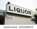 Small photo of Liquor Sign. Liquor Store. Neon Sign. Building Sign. Food and Drink. booze. alcohol. Liquor. For sale.
