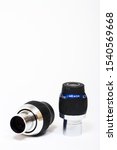 Small photo of Leeds England UK September 12 2019 Meade 4.7mm and 8.8mm focal length telescope eyepiece isolated on a white background - Editorial