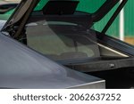 Small photo of Opened sunshade. Car side window curtains sunshades. Sunblind curtain in a modern car.