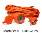 Orange power extension cord on white background