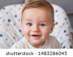 Small photo of Beautiful smiling cute baby. Beautiful expressive adorable happy cute laughing smiling baby infant face. Children, people, infancy and age concept - beautiful happy baby