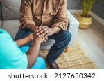 Small photo of Caring nurse in white coat holding hands of old man patient express compassion provide physical or psychological help, arms close up. Concept of relief loneliness, incurable disease, nursing, empathy