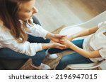 Small photo of Little boy holds hands looks at aged therapist or pediatrician tell complaints to trustworthy medical worker at visit, trust relations with doctor, share disorder problems with psychologist concept