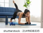 Small photo of Athletic Healthy Asian young woman in sportswear workout legs excercise at home.Young female with slim body cardio aerobic exercises for healthy wellness life.Healthy lifestyle concept