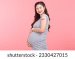 Small photo of Pregnant Asian Woman smile and happiness after received anti virus vaccine cheerful with bandage isolated on pink background,Pregnancy of young woman enjoying with safety life after got vaccination