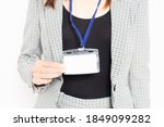 A business woman showing a name folder shot in the studio