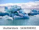 Small photo of Icebergs floating. Ices and volcanic ash. Glacier lagoon. Melting ice. South coast Iceland. Jokullsarlon lagoon. Volcanic ash on the ice. Ice age glacier. big glacier melting fast. Global warming